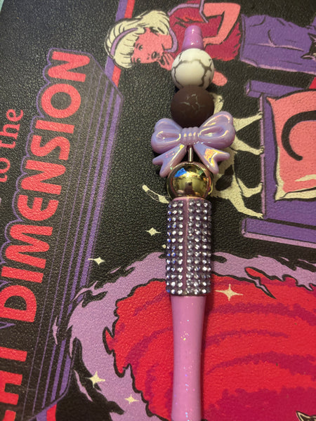 Purple sparkling bow pen