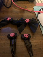 Pink black skull bows and clips