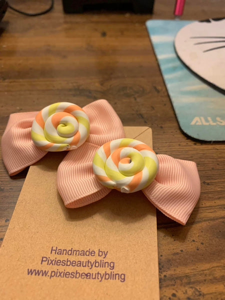 pink swirl bow adult or child  set of two